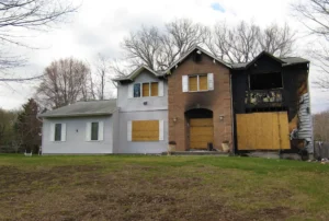Condemned house, boarded up after a house fire.