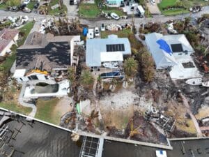 Storm damage restoration. An aerial of the aftermath of the destructive Hurricane Ian in a coastal residential area, Florida